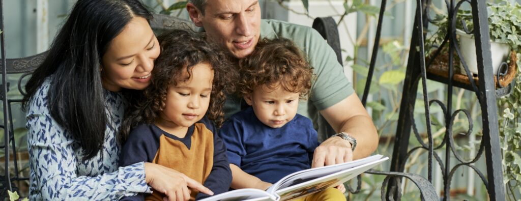 family reading book together